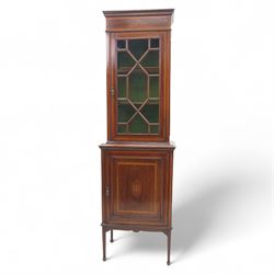 Edwardian inlaid mahogany display cabinet, the moulded cornice above an astragal glazed door enclosing two baize lined shelves, the lower section with a panelled cupboard door, raised on square tapering supports