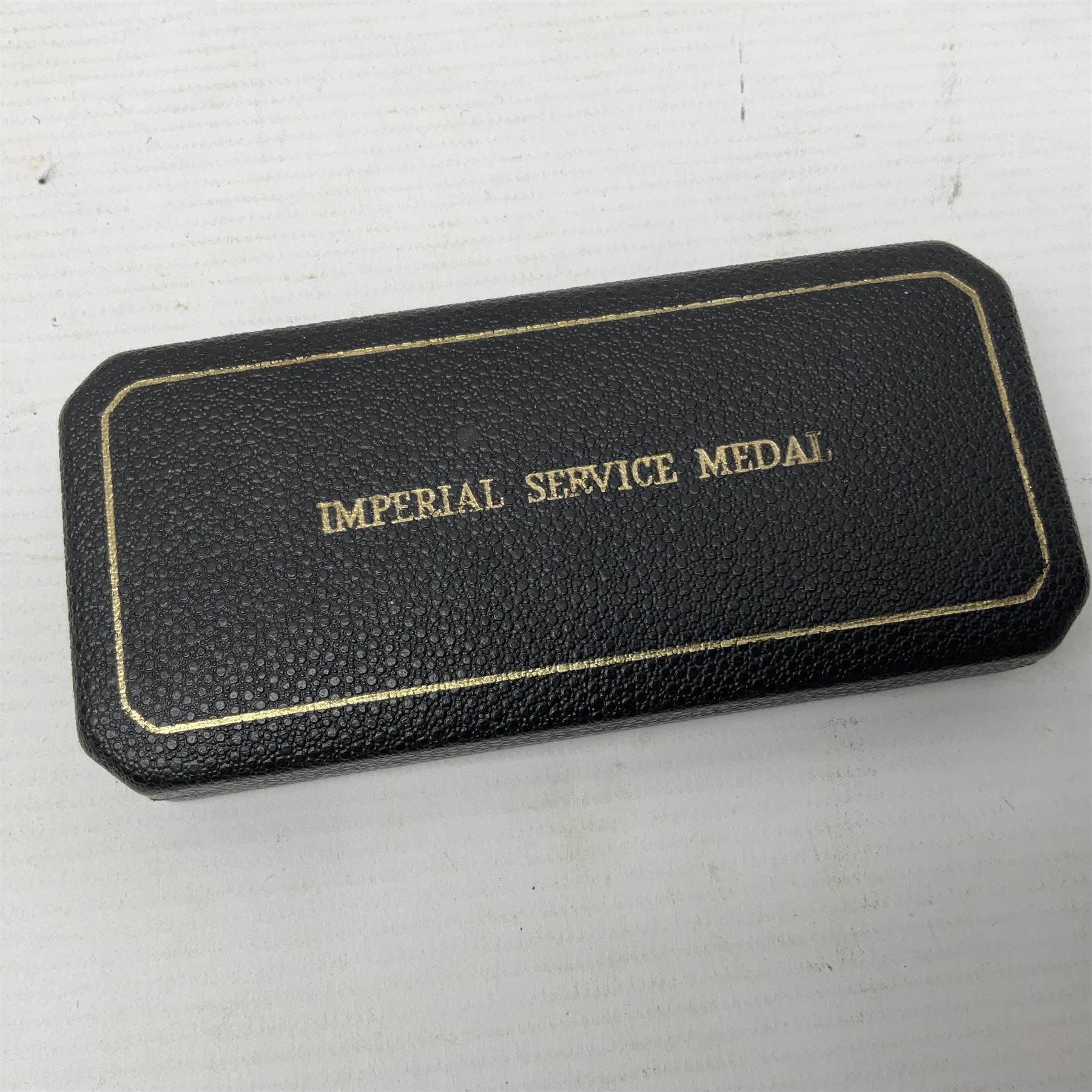 Two Imperial Service Medals to Elsie Hannah Ferguson and Fred Whitehead; each in original case; WWI Special Constabulary Medal to Inspr. Alfred W. Thompson; modern Prisoner of War Medal; cased; replica Victoria Cross and India Mutiny Medals with archive of information relating to Pte. Robert Newell V.C. 9th Lancers; replica Victoria Cross and George Cross with miniatures; and other replica medals etc