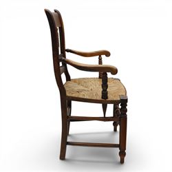 19th century elm chair, with curved top rail and bobbin turned spindles, woven rush seat, on turned legs united by front stretcher