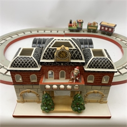 A Villeroy & Boch porcelain Christmas table decoration, modelled as a railway station with track, engines and carriages.