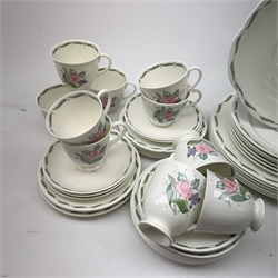 A Susie Cooper for Wedgwood Fragrance pattern tea service, comprising teapot, milk jug, open sucrier, fix teacups, five smaller teacups, five saucers, four further saucers, six side plates, five side plates with frilled rim, a slightly larger side plate, six dessert plates, six larger plates, six bowls, and a sandwich plate. 