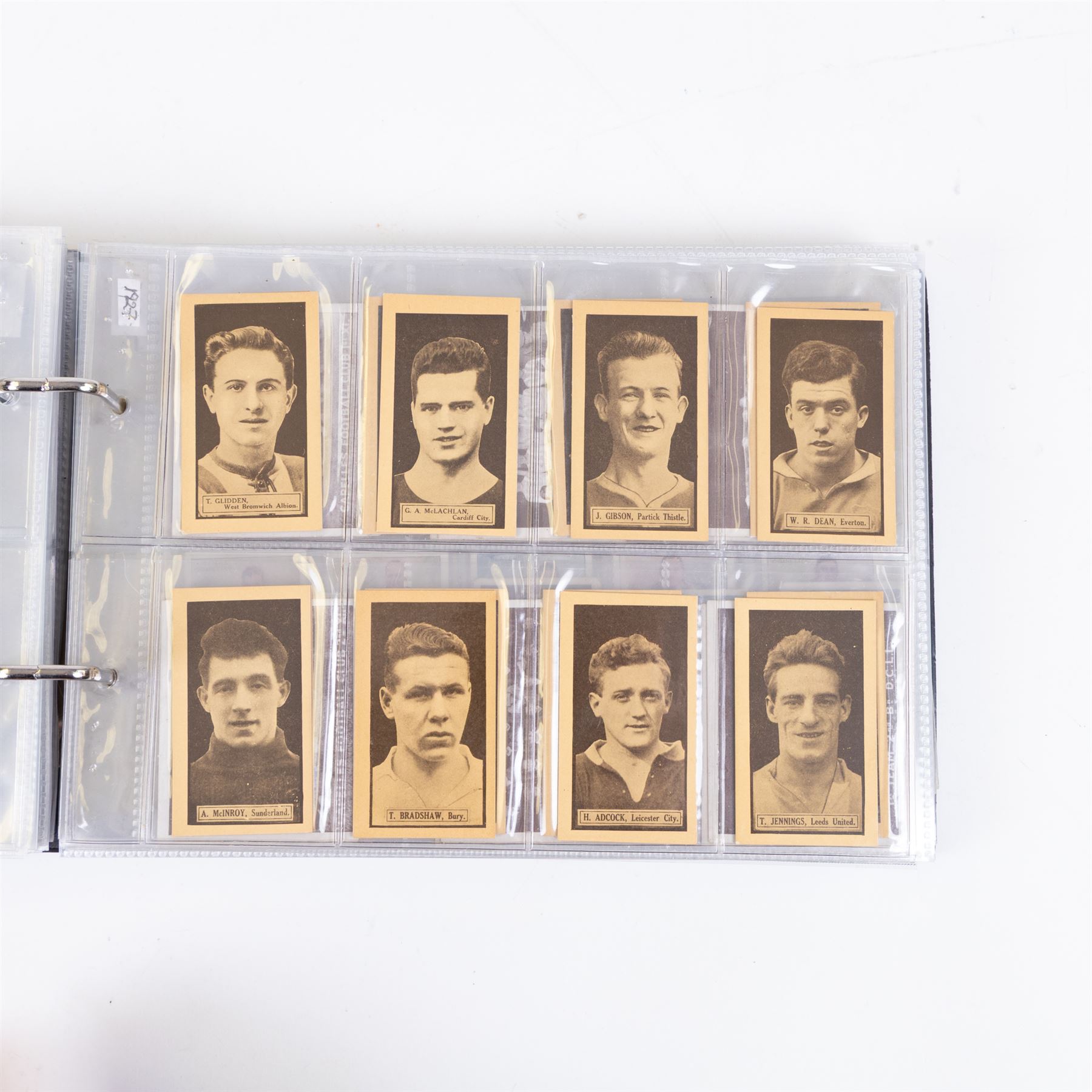 Collection of Edwardian and later Football related trading and cigarette cards, including forty-nine of fifty 1906 Ogden's Football Club Colours, 1922 PALS Footall series, ninety of one hundred 1925 Gallaher Famous Footballers, complete set of forty-four 1926 Ogden's Captains of Association Football Clubs and Colours, complete set of fifty 1927 Players Football Caricatures by MAC,  complete set of fifty 1927 Players Football Caricatures by RIP,  complete set of fifty 1930 Players Association Cup Winners, complete set of 50 1933 Ogdens AFC Nicknames etc, housed in brown cigarette card album