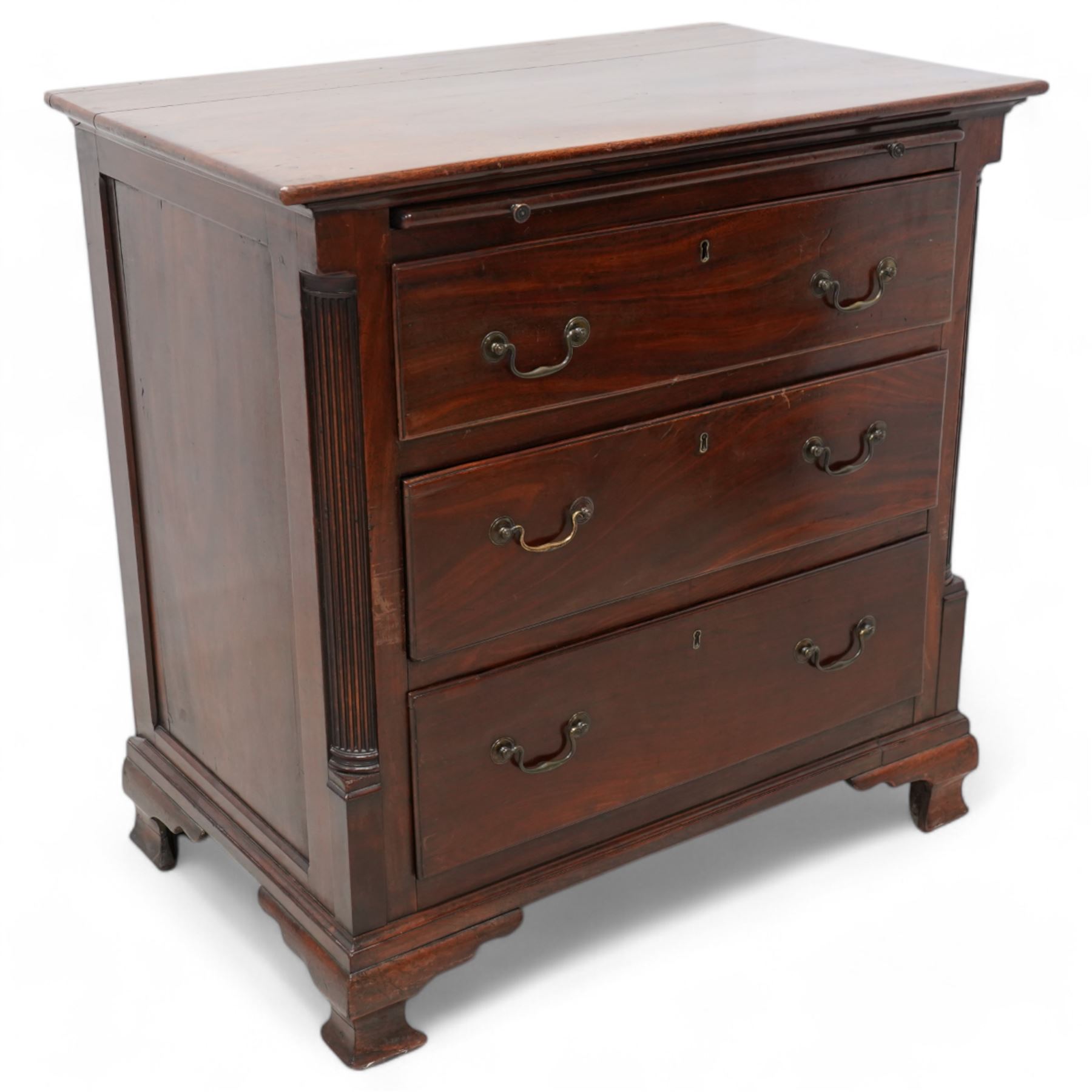 Georgian mahogany bachelor's chest, brushing slide over three long drawers, enclosed by canted corners with fluted quarter columns, on ogee bracket feet