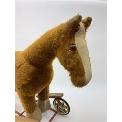 Pedigree push along plush covered horse 1950s-60s with red tubular metal framework and beech foot rests H25