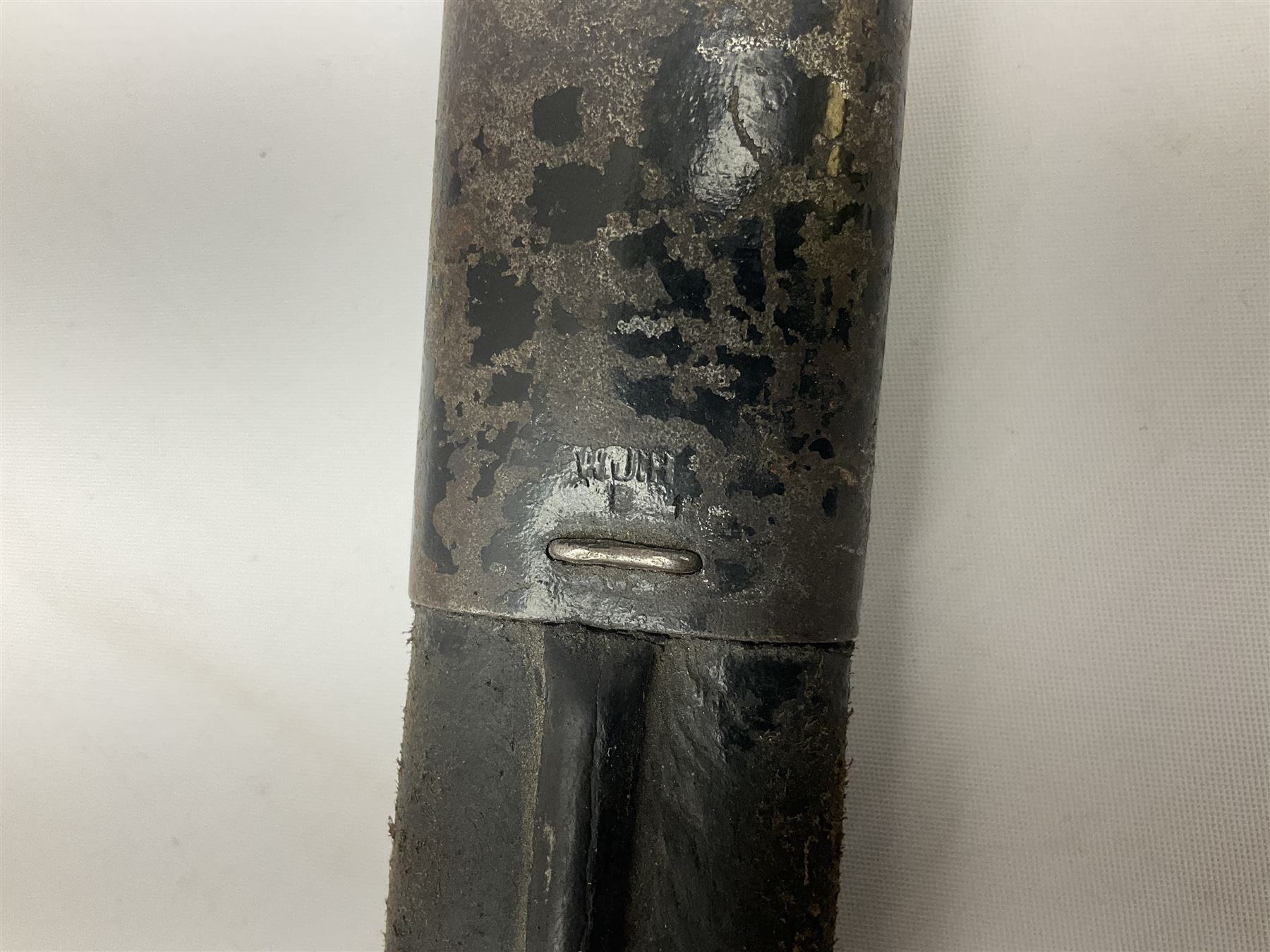 British Enfield 1907 model SMLE bayonet, with 43cm fullered steel blade and metal mounted leather scabbard L58cm overall; and Schmidt-Rubin Model 1918 bayonet the 30cm steel blade marked Elsener Schwyz No.579722; in steel scabbard with leather frog marked G. Bertolini Sellaio Vira/G.Tic 79 L45cm overall (2)