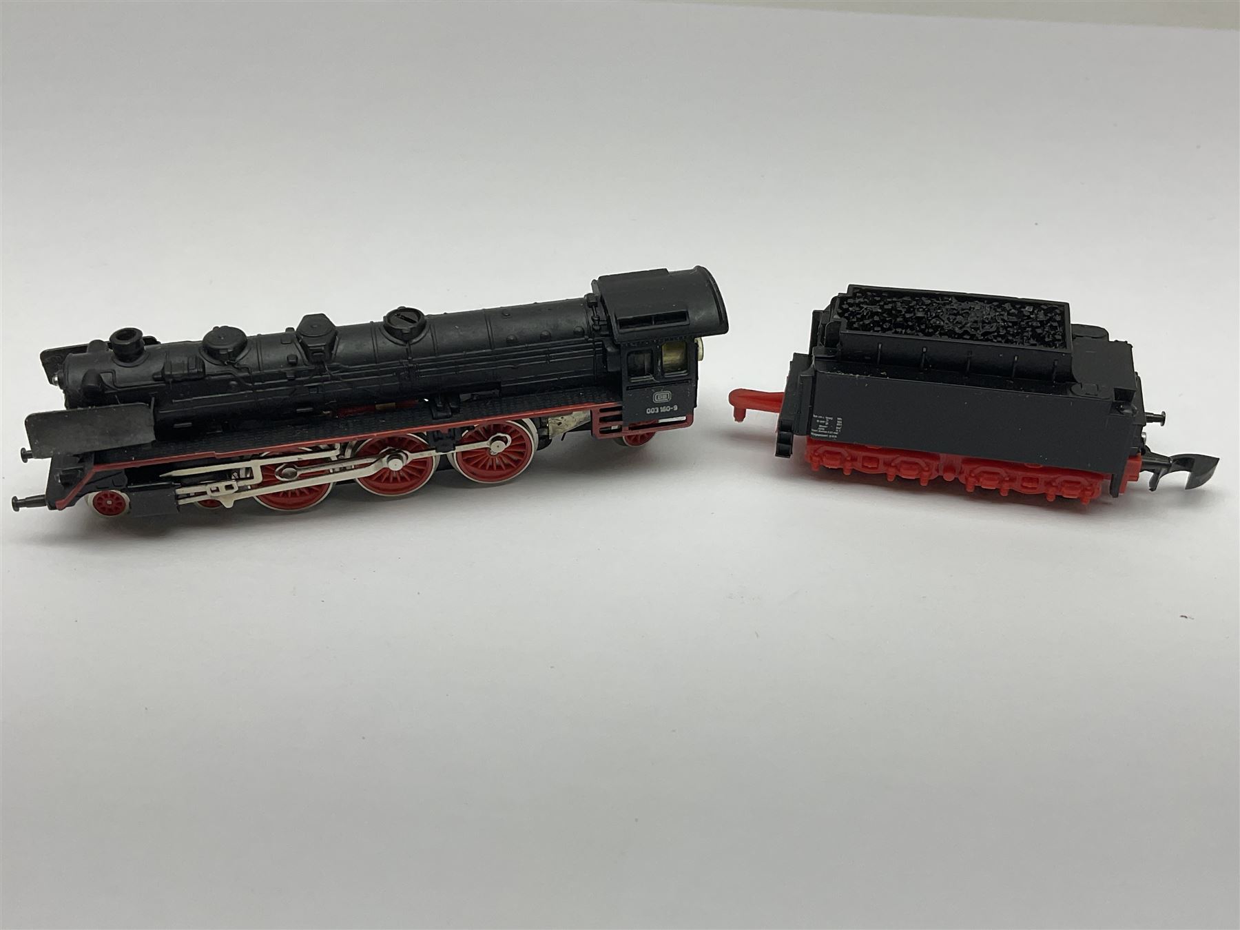 Marklin mini-club 'Z' gauge - DB Diesel Co-Co type locomotive; DB 0-6-0 Rangierlok type shuttle locomotive probably no.8864; and another DB 0-6-0 locomotive probably no.8800; together with an unmarked DB 4-6-2 tender locomotive and DB 2-6-0 tender locomotive; all unboxed (5)