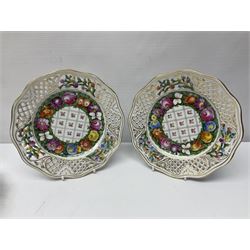 Six Dresden plates, with a pierced and fret border, with gilt rim and painted flower, with printed mark beneath, D18cm