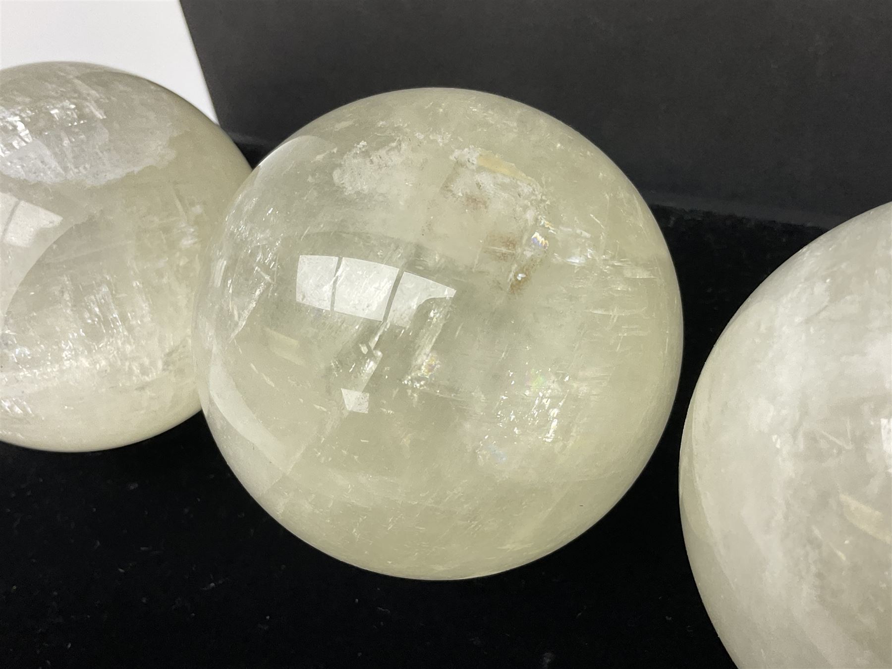 Set of three clear calcite spheres, D8cm