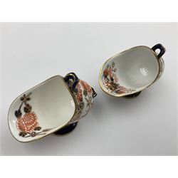 Group of Crown Derby and Royal Crown Derby Imari pattern miniatures, including mid 19th century Stevenson and Hancock cauldron, with painted mark beneath, H5.5cm, a near pair of early Royal Crown Derby scuttles, decorated in the 6299 pattern, each with printed and painted marks beneath including illustration date codes for 1913 and 1922, tallest 6.5cm, and a further early 20th century Royal Crown Derby scuttle, decorated in the 6299 pattern, with printed and painted marks beneath including illustration date code for 1922, H5.5cm, (4)
