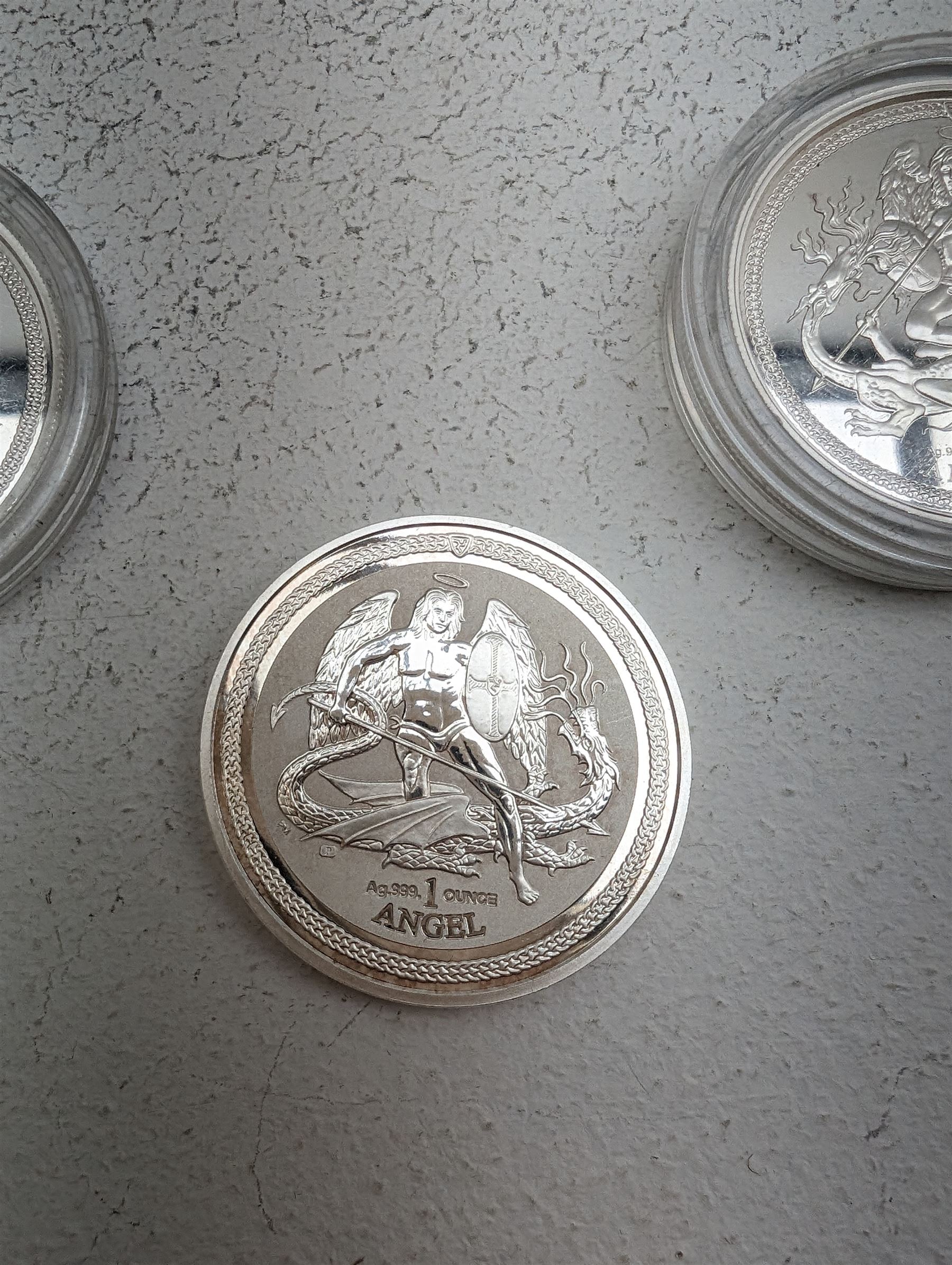 Three Queen Elizabeth II Isle of Man one ounce fine silver coins, comprising 2016, 2018 one angels and 2018 one noble 