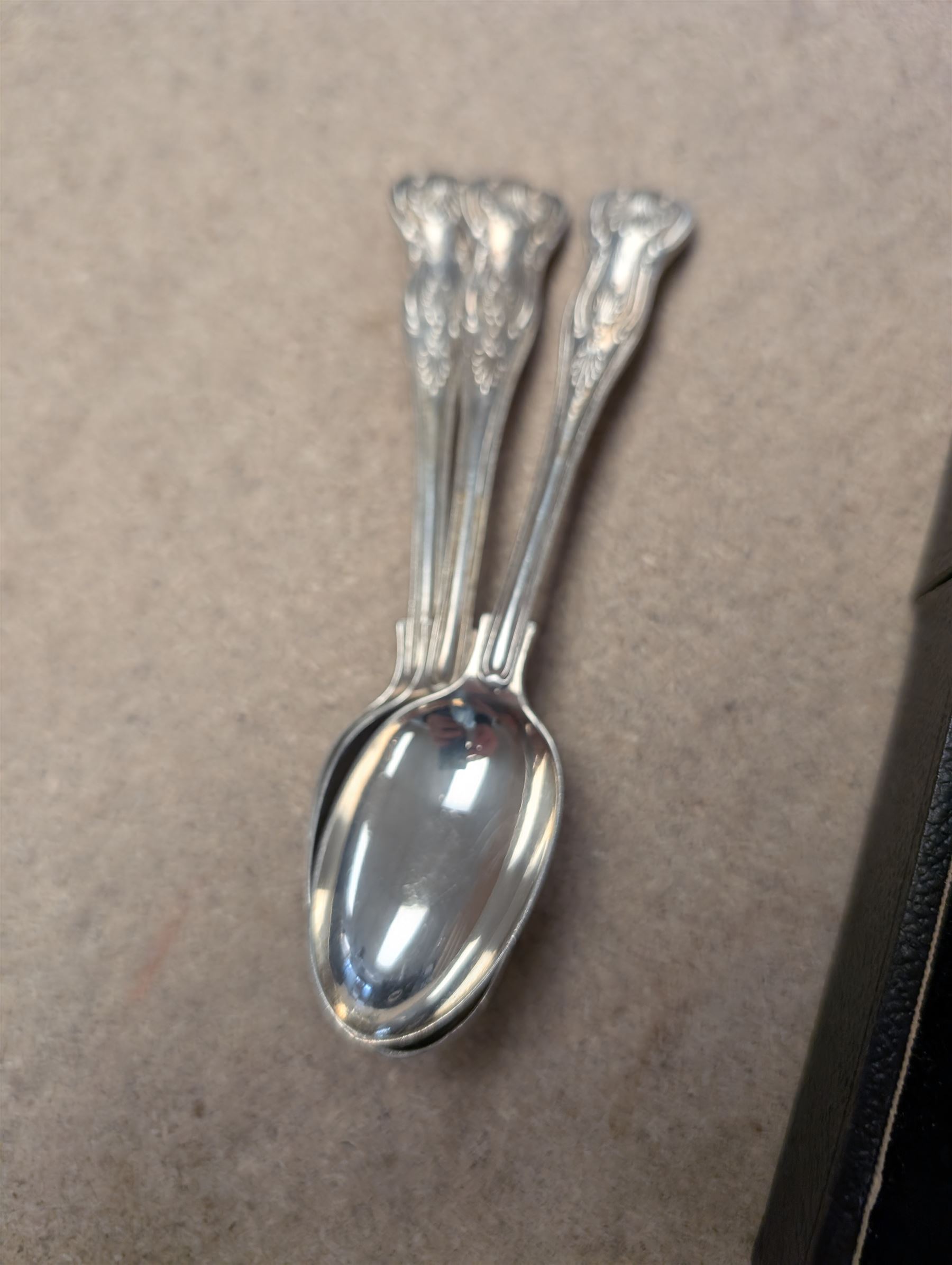 Group of silver, comprising mustard pots, open salts, napkin ring, spoons, sugar tongs and fruit knife, all stamped or hallmarked 