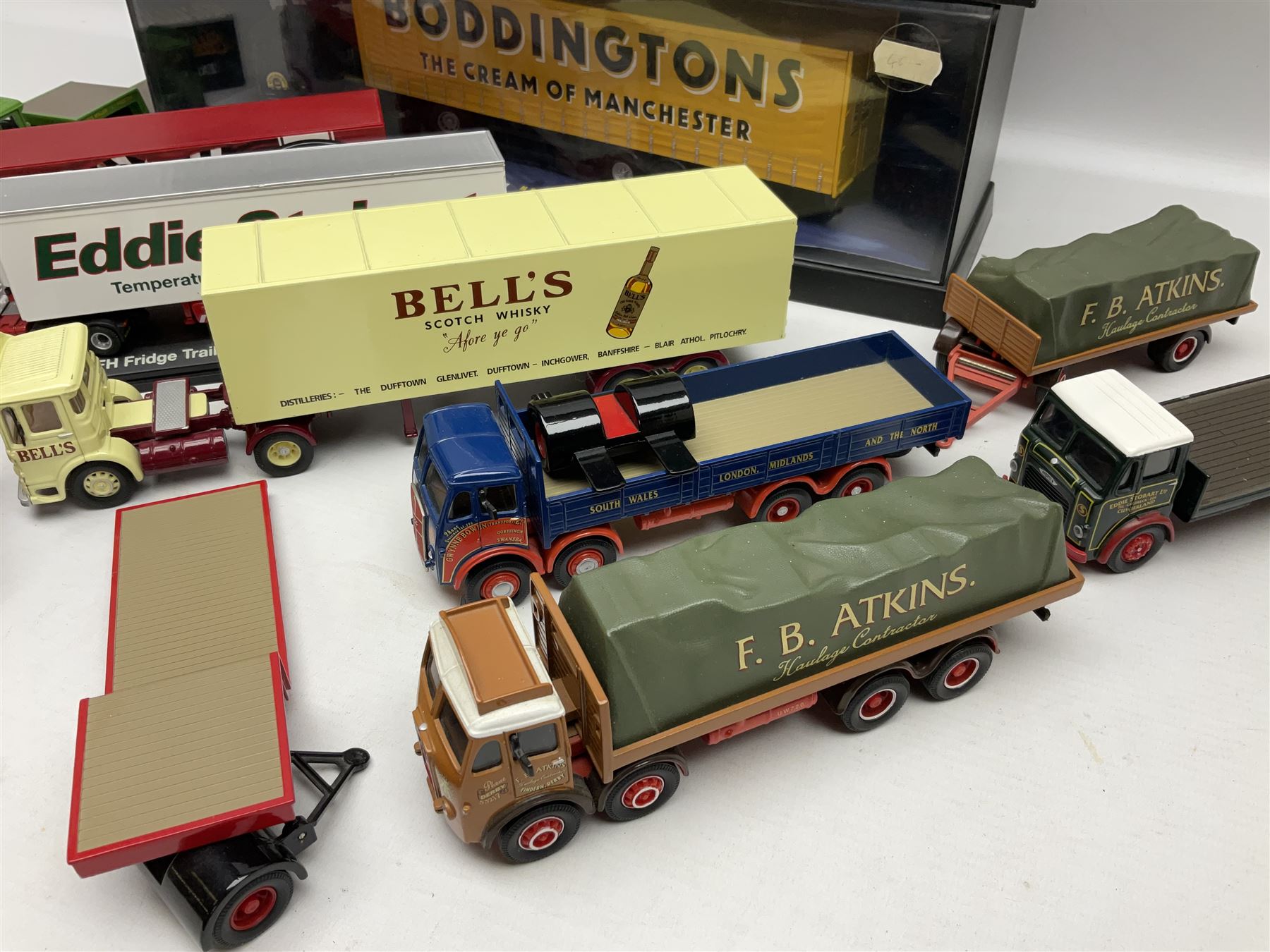 Corgi - two perspex cased 'Modern Trucks; 75202 ERF Curtainside Boddingtons and 75402 Leyland-DAF Curtainside Tate & Lyle; and nine unboxed Corgi lorries (11)