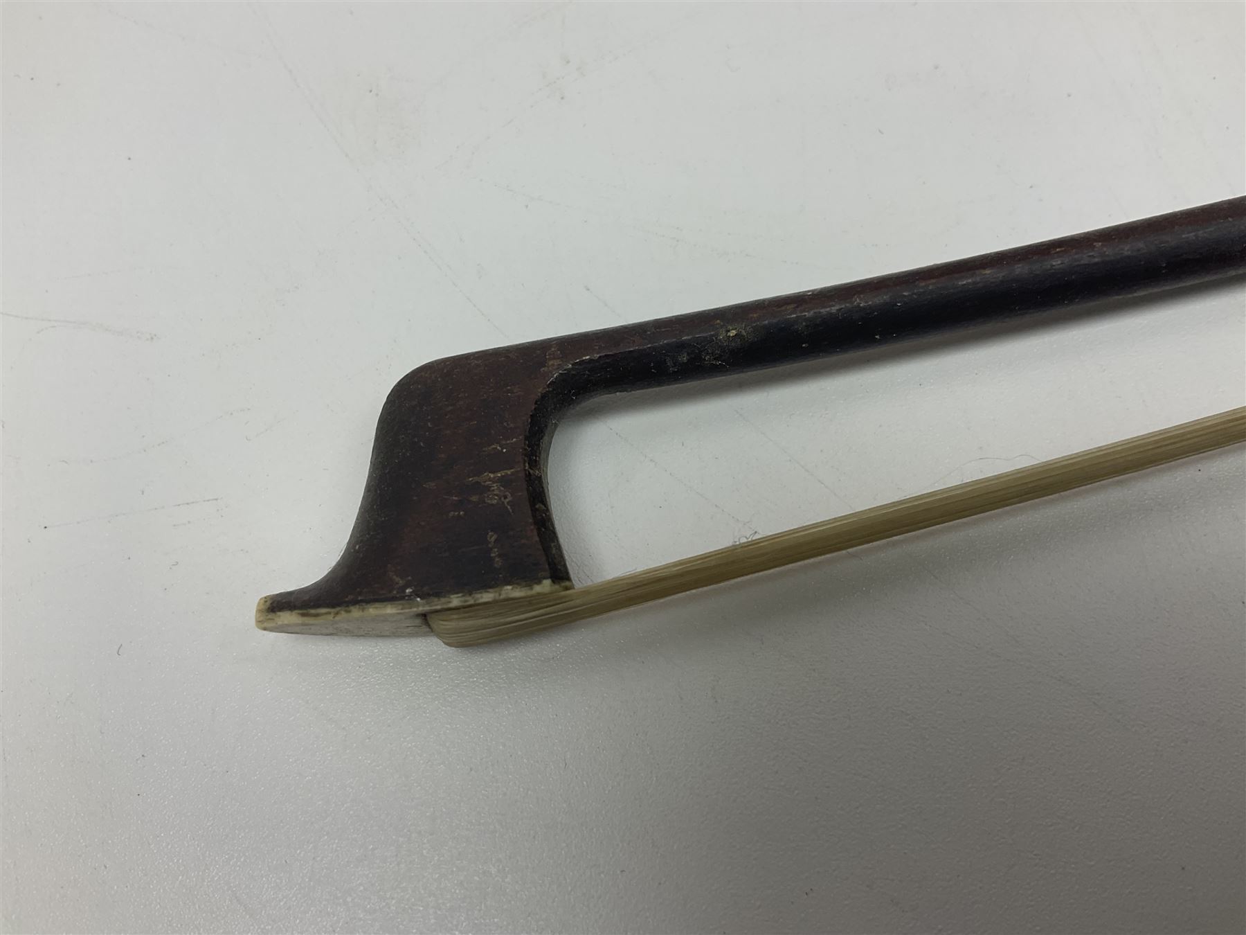 Fruitwood and elm single string phono fiddle with long neck and copper horn L76cm; and a violin bow (2)