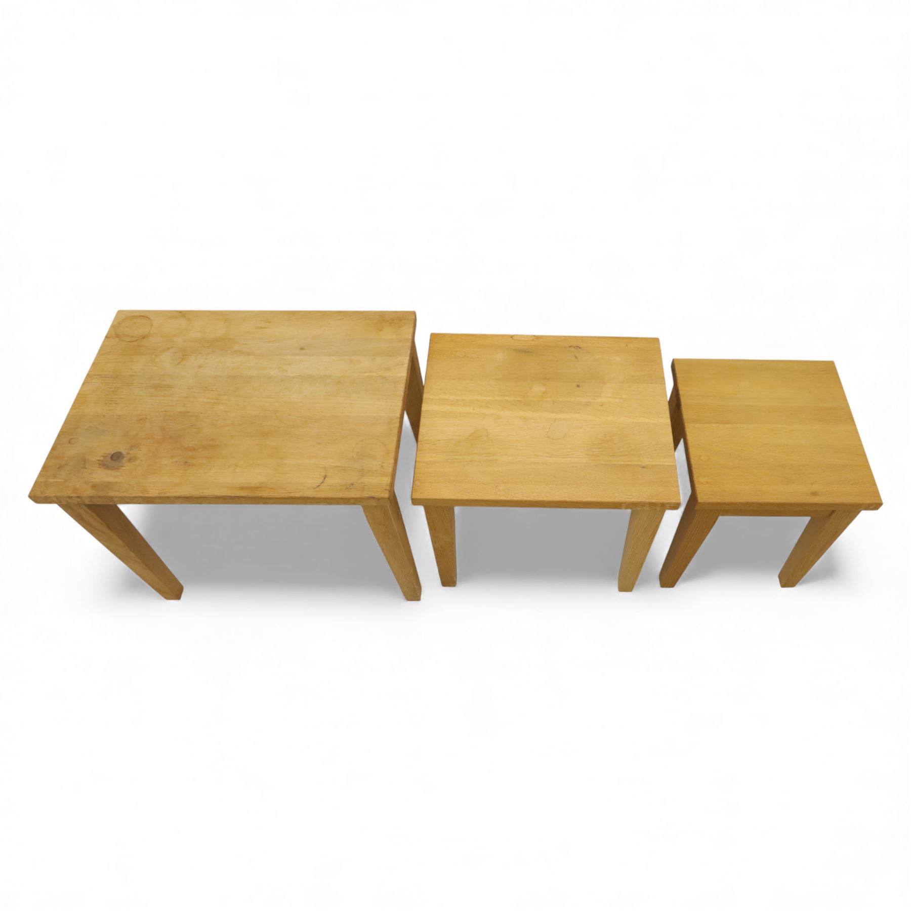 Modern solid oak nest of three tables, each with straight-edged rectangular top and square legs