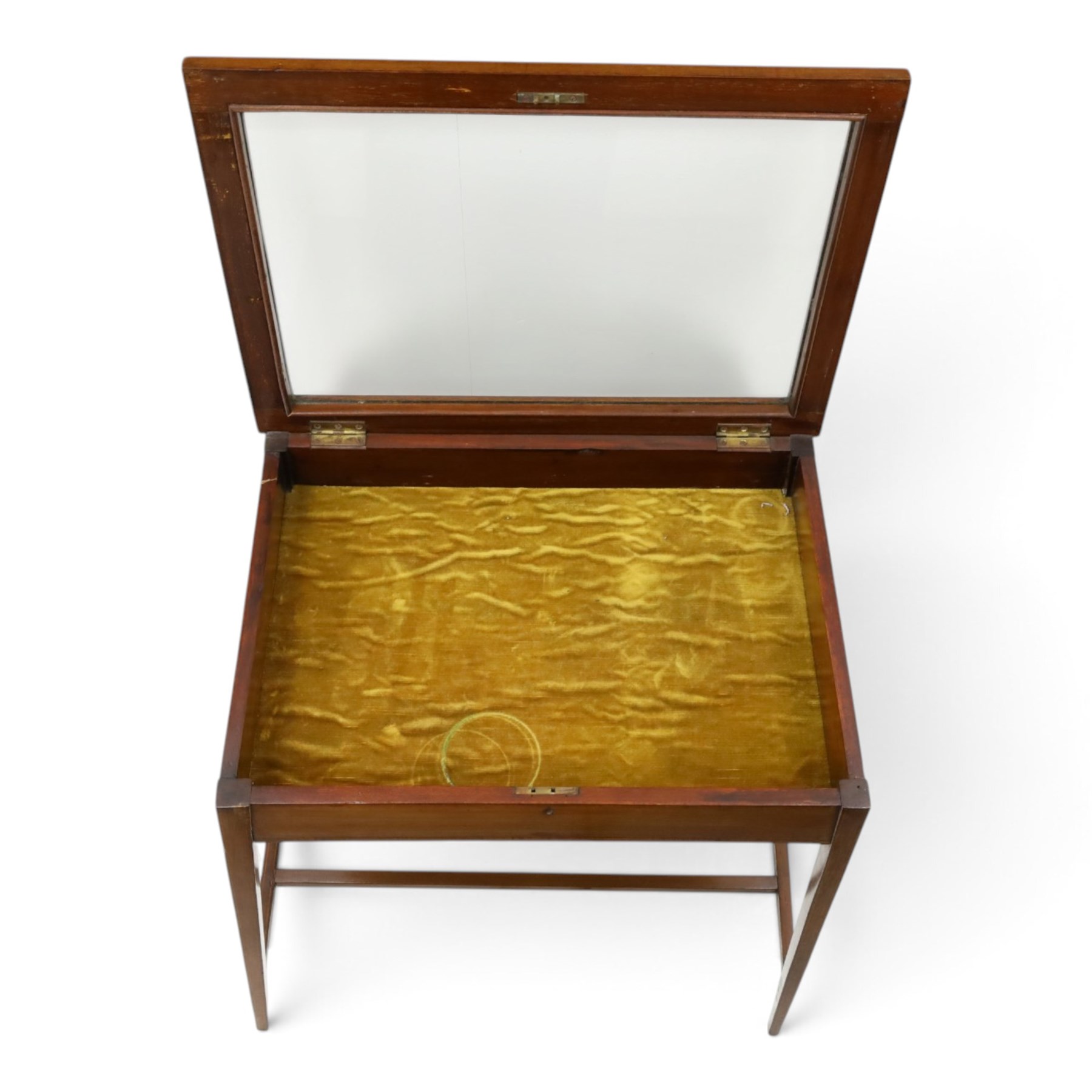 Edwardian inlaid mahogany bijouterie table of elegant proportions, rectangular hinged glazed top with mahogany banding, raised on splayed square tapering supports united by double-H stretcher