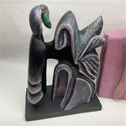 Helen Skelton (British 1933 – 2023): Three carved wooden abstract sculptures, two in pink tones, the third in dark tones, largest H77cm. Born into an RAF family in 1933 in Kent and travelled the world extensively during her childhood. After settling in Bridlington, Helen immersed herself in painting, textiles, and wood sculpture, often inspired by nature's beauty. Her talent was showcased in a one-woman show at Sewerby Hall and recognised with the sculpture prize at Ferens Art Gallery in 2000. Sadly, Helen’s daughter passed away from cancer in 2005. This loss inspired Helen to donate her sculptures to Marie Curie upon her passing in 2023.