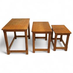 Mouseman - nest of three oak occasional tables, rectangular adzed top, on octagonal supports united by plain stretchers, each carved with mouse signature, by the workshop of Robert Thompson, Kilburn
Largest: Height: 48cm  Length/Width: 61cm  Depth/Diameter: 38cm