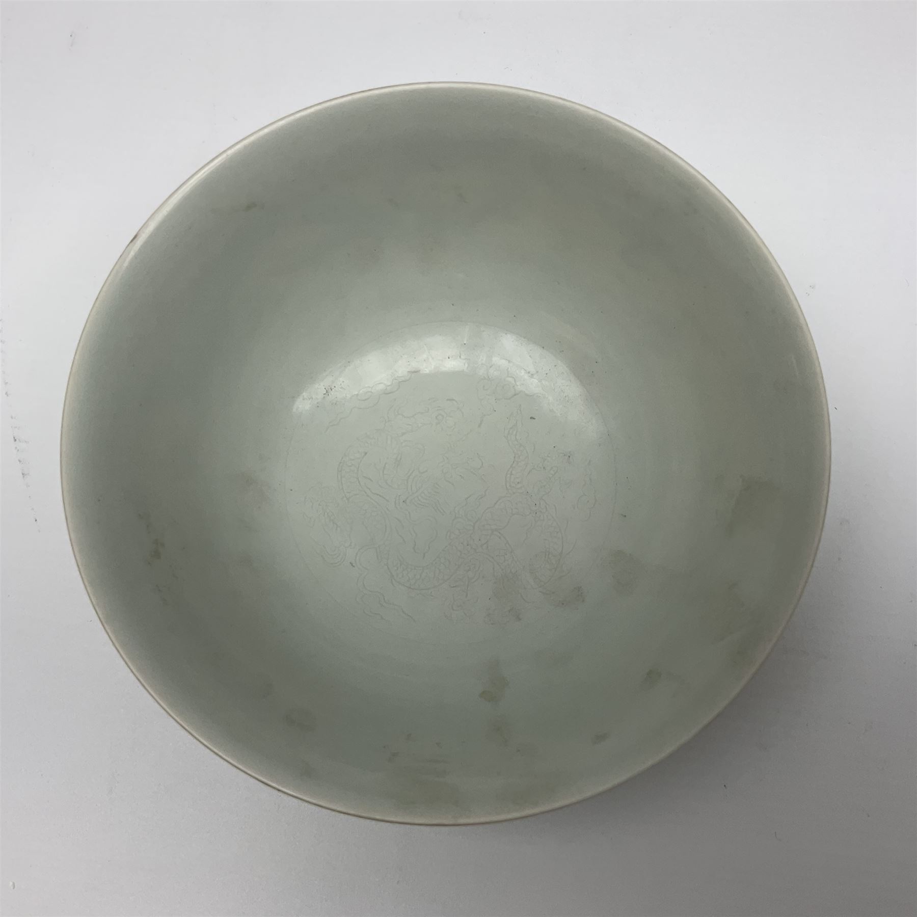 Pair of Chinese famille jaune bowls, decorated in green enamel with a dragon chasing a flaming pearl amongst clouds, upon a yellow ground, the interior decorated to centre with dragon, with six character mark beneath, D17.5cm