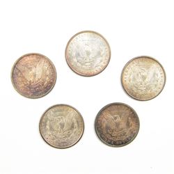 Five United States of America silver Morgan dollar coins, dated 1882, 1883, 1884 O, 1885 and 1889