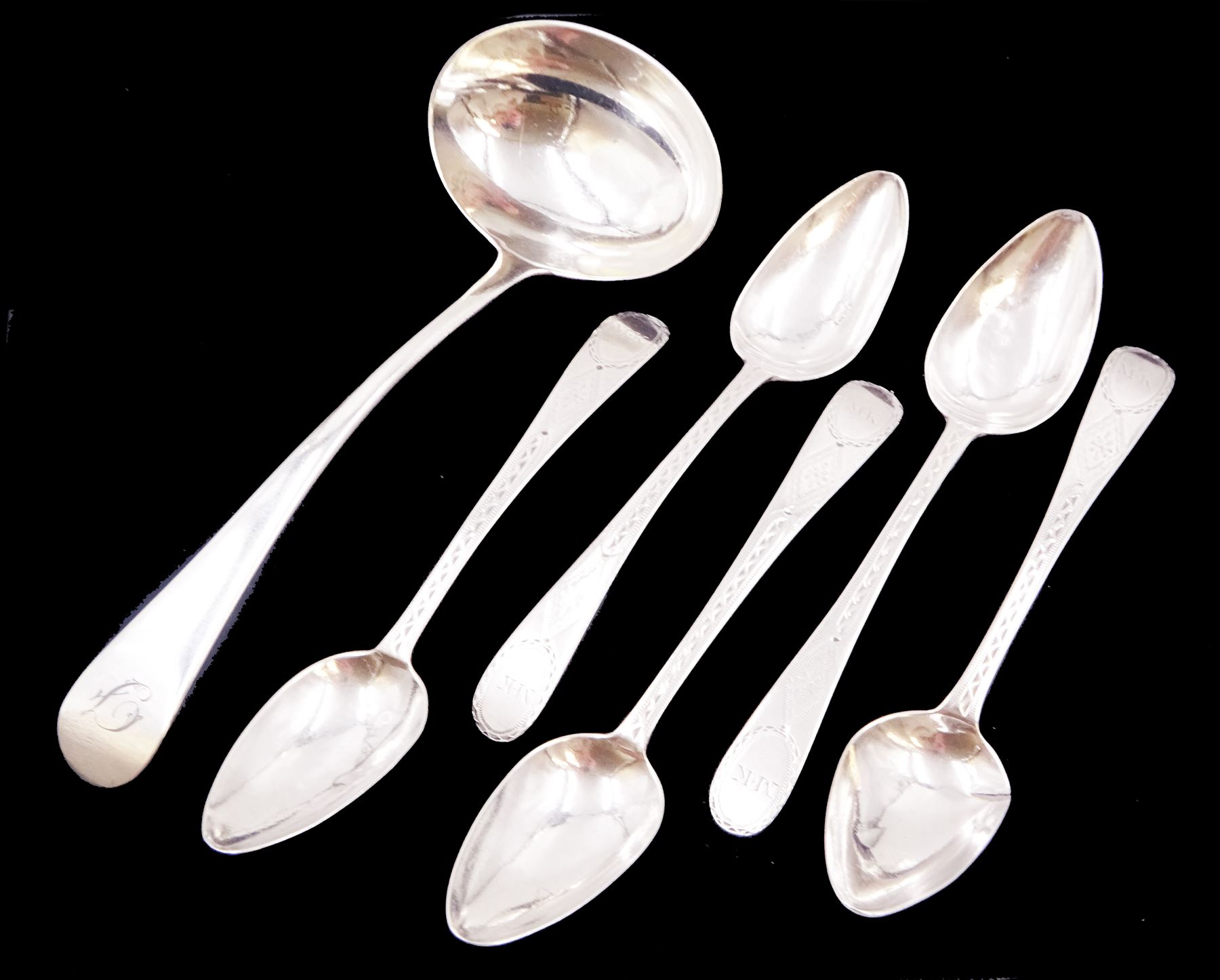 Set of five George III Newcastle silver Old English pattern teaspoons, with engraved initials and pinprick decoration, hallmarked Christian Ker Reid, Newcastle, no date letter, together with a George III silver Old English pattern sauce ladle, engraved with initial to terminal, hallmarked Peter & William Bateman, London 1809