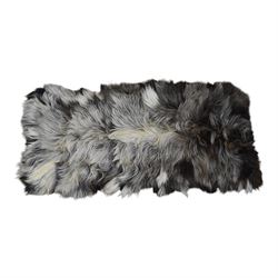 Skins/Hides: cow hide with brown and white dappled pattern together with another hide, possibly Mongolian goat