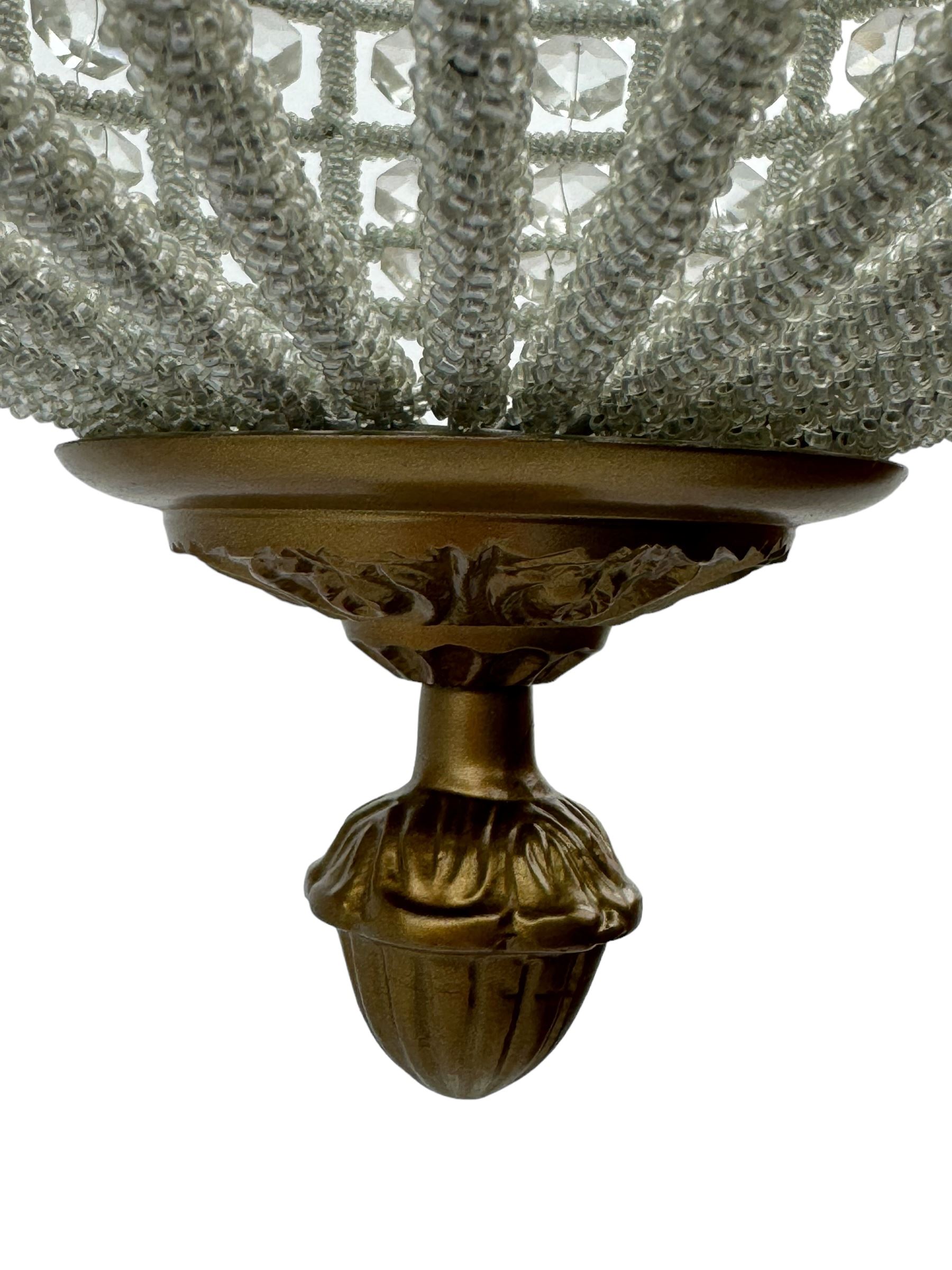 India Jane Interiors - pair of gilt metal and glass spherical ceiling light pendants, decorated with glass beads and pendants, foliage cast metal upper band, mounted by lower finial - ex-display/bankruptcy stock 