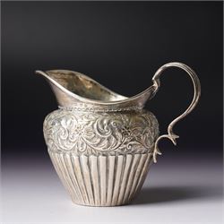 George III silver cream jug with crimped rim and scroll handle, Victorian silver cream jug with embossed decoration Birmingham 1888 and three silver golf spoons Birmingham 1961