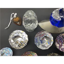 Swarovski Crystal paperweights, to include a globe with dove to the top, pyramid shapes etc, together with a large collection of boxes and stands  