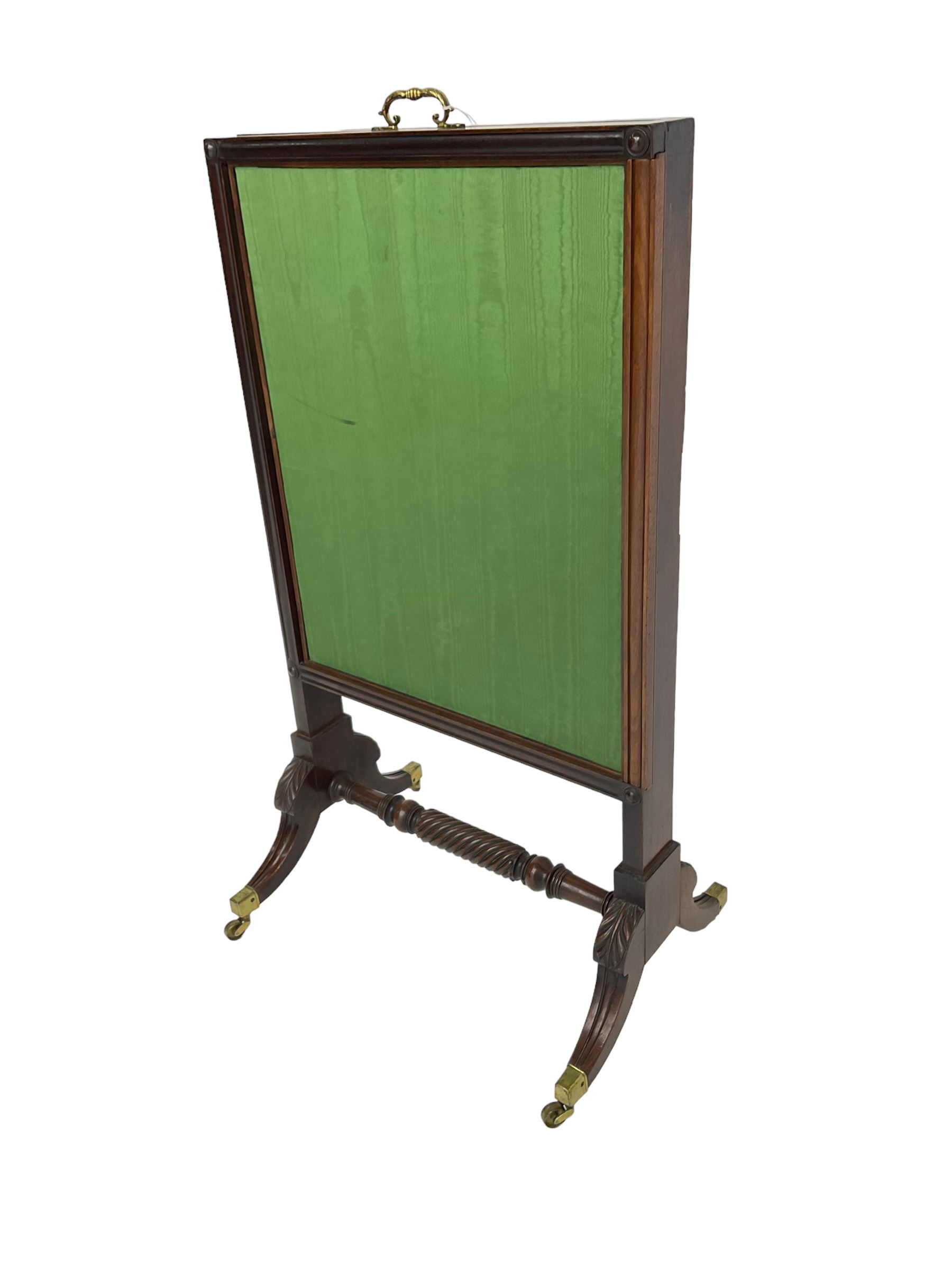 Regency mahogany screen with two horizontal and one vertical pull-out panels, on base with carved sabre legs and rope-twist stretcher