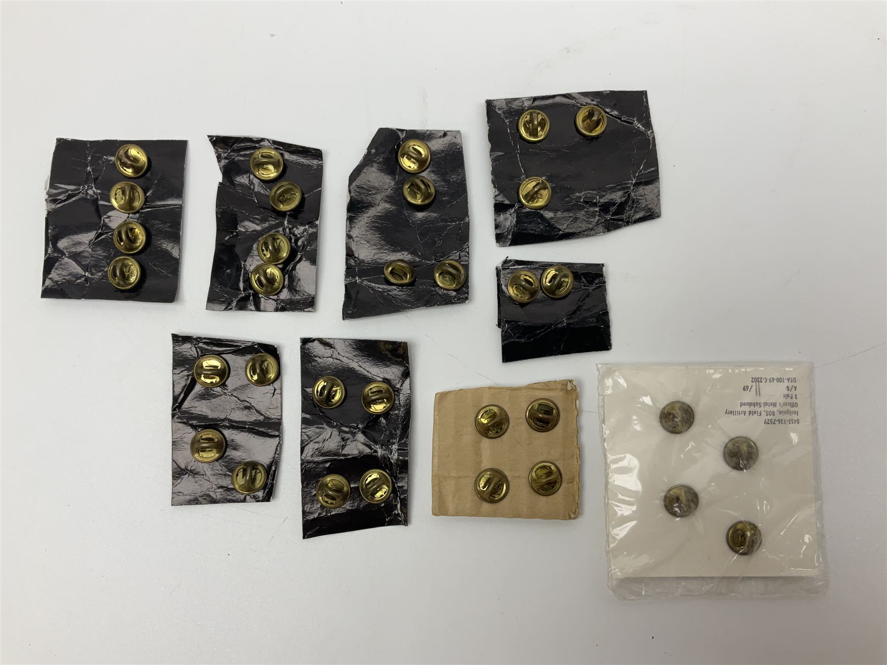 Fifty US rank badges and trade badges; WW2 and Vietnam period; predominantly on sale cards