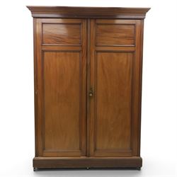 Edwardian walnut double wardrobe, fitted with two panelled doors, opening to reveal fitted interior with hanging space, three sliding linen trays and three drawers