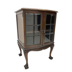 Mid to late 20th century mahogany bow front cabinet, the moulded top over two glazed doors with bevelled glass, moulded and foliage carved apron, acanthus decorated cabriole supports with ball and claw feet