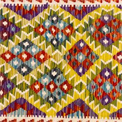 Afghan Maimana kilim flatweave runner, central field features large bold nested diamond motifs and stylized geometric lozenge patterns on olive purple, blue, and green tone ground, border stripe in teal ground, and fringe