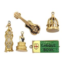 Five 9ct gold pendant/charms including Soda Syphon, cheque book, wedding cake, bird in a cage and guitar, all hallmarked