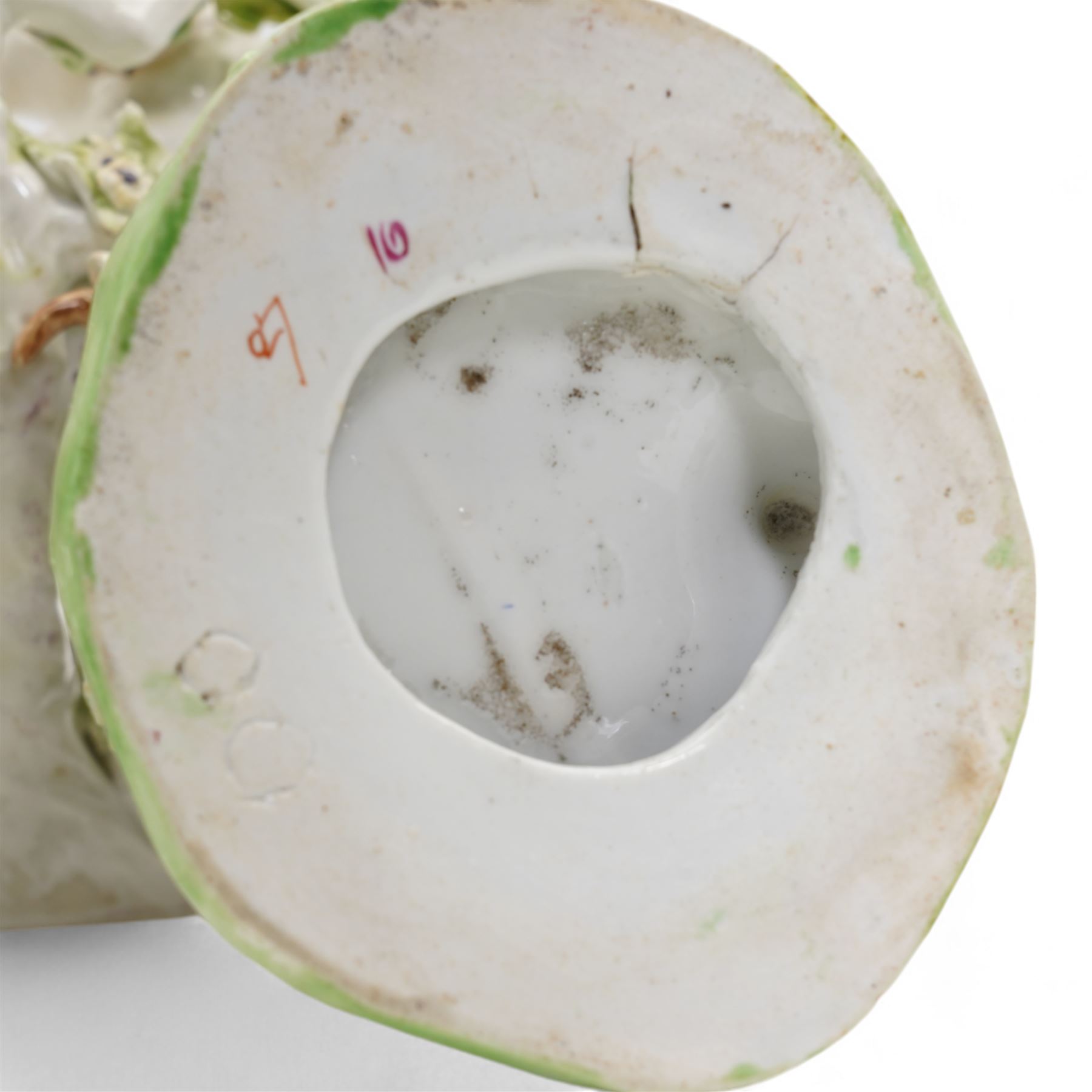 Two 18th century Derby porcelain groups modelled as a ram standing before bocage above a recumbent lamb, upon flower encrusted base, H15cm and two further Derby figures modelled as a ram and cow and calf (3)