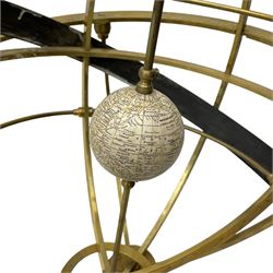 19th century brass terrestrial armillary sphere on rosewood base, lobe carved column on three splayed supports with scrolled carved terminals, the supports united by circular compass with turned stretchers