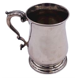 Early George III silver mug, of plain bellied form with acanthus capped scroll handle, upon a stepped circular foot, hallmarked Fuller White, London 1762, H12cm, approximate weight 10.35 ozt (322.1 grams)