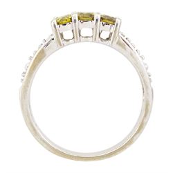 18ct white gold three stone fancy yellow diamond ring, with diamond set shoulders, hallmarked, total yellow diamond weight approx 0.40 carat