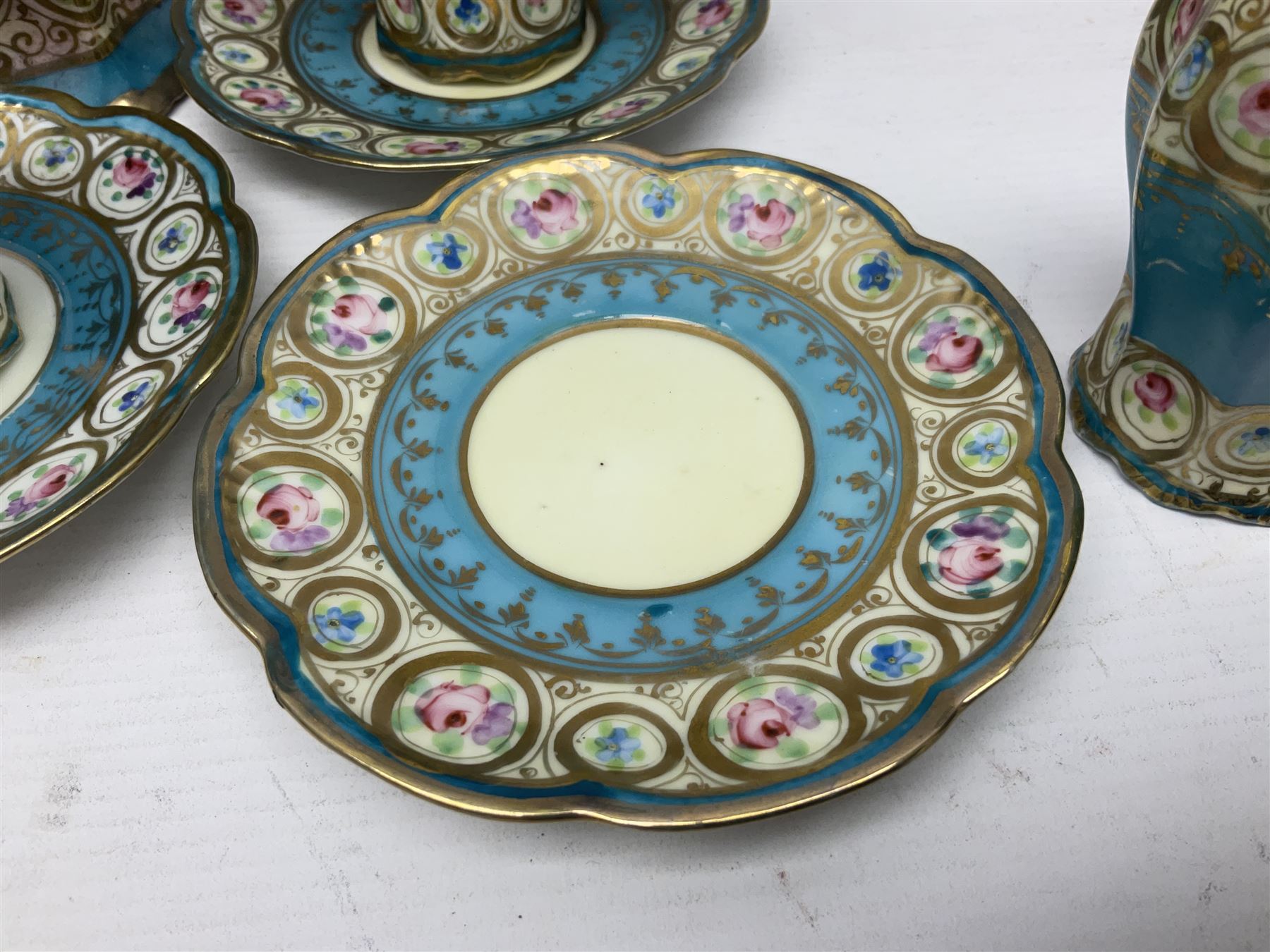 Noritake coffee service, hand painted with roses and gilt detail on a blue ground, comrosing coffee pot, five cups and saucers