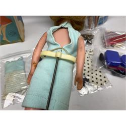 1960s Palitoy Tressy fashion doll, boxed with stand and booklets; four additional Tressy outfits (In The Office, Winter Journey, Winter Sports and Evening Date); two other outfits; and Tressy's Little Sister Toots doll with Style Book and additional outfit