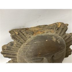 Carved pine mask of the sun, probably late 17th/early 18th century, originally a cresting, bearing Christie's lot labels, D20cm

Provenance 
Lot 161, Christopher Howe - The First Twenty Years, Christie's. 24th March 2004
