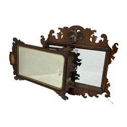 Early 20th century walnut Chippendale design wall mirror, shaped fretwork frame carved and pierced with Ho Ho bird, foliate carved inner slip enclosing plain mirror plate (71cm x 67cm); together with a similar Chippendale design mirror (A/F) (85cm x 49cm)