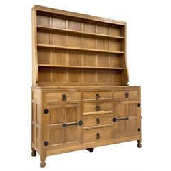 'Mouseman' adzed oak dresser, raised three heights plate rack, six drawers and two cupboards, carved with mouse signature, by Robert Thompson of Kilburn