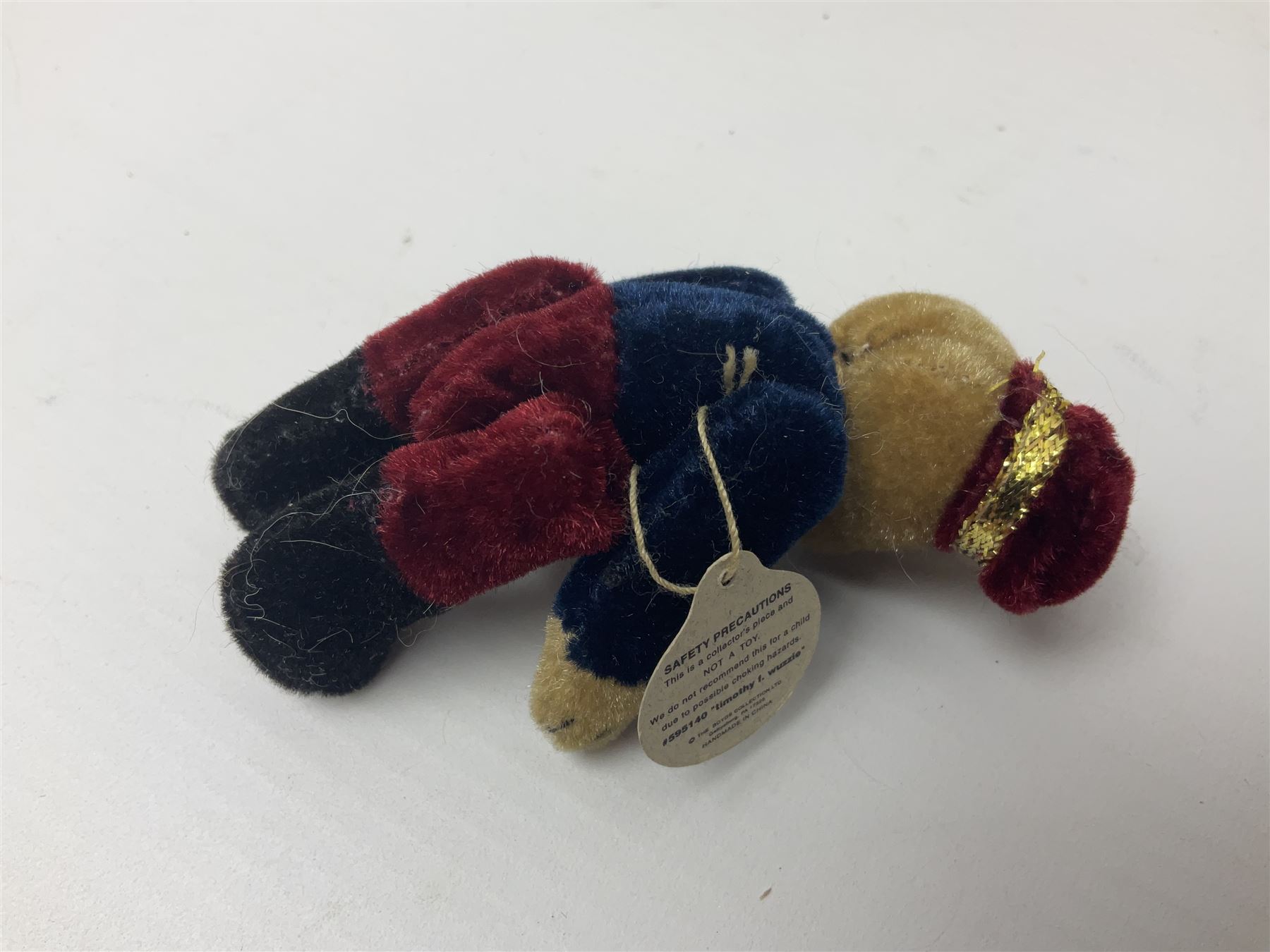 Group of five teddy bears comprising ‘George’ a unique pellet filled bear with glass eyes and velvet paws H38cm, and ‘Abbey’ a luxury German plush with wobble head and glass eyes no.5/10 H24cm, both with Teddies from Bearyland labels; along with two light blonde mohair H. M. Bears and Boyds Bears ‘T. F. Wuzzies’ no. 595140 (5)