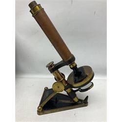 Late 19th/early 20th century brass monocular microscope by R. & J. Beck London No.6219, the cast triangular base with adjustable hinged strut support and rack and pinion focussing H45cm extended; in fitted mahogany box with lift-out tray of approximately twenty specimen slides and additional lenses; case W40.5cm 