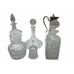 glass claret jug with silver plated mount H30cm, together with a selection of decanters of various forms, a cut glass bowl and place mats. 