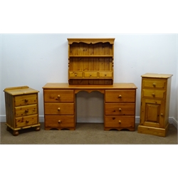  Solid pine twin pedestal dressing table, moulded top, six drawers, shaped plinth base (W150cm, H72cm D45cm), a narrow pine chest, two drawers, single cupboard (W43cm, H93cm, D41cm), solid pine bedside chest, three drawer and a wall hanging unit, two shelves and three drawers (4)  
