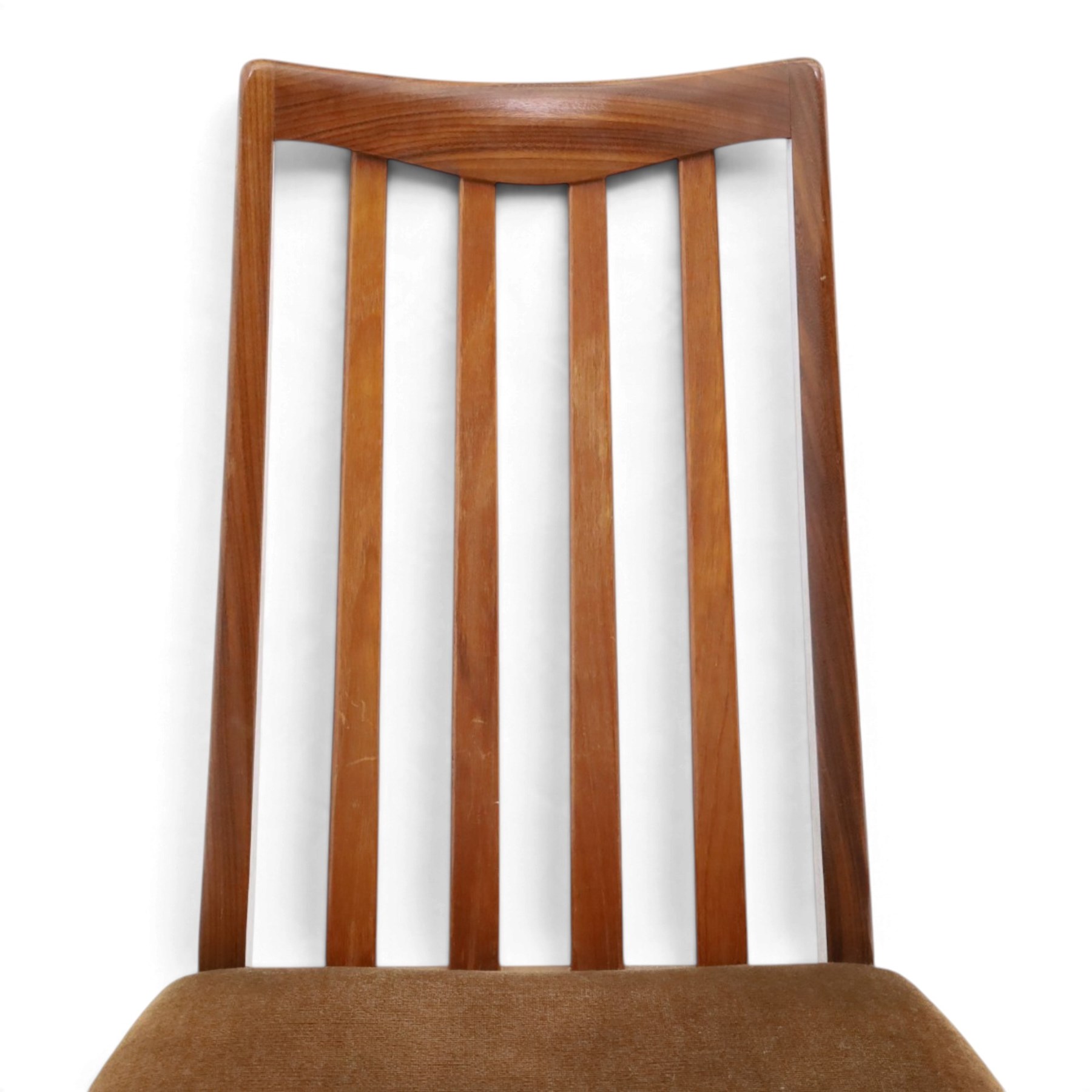 G Plan - Mid 20th century teak extending dining table and four chairs, oval top with stowed fold-over leaf extending to 208cm, raised on two shaped supports united by a stretcher 