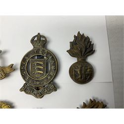 Nineteen Yeomanry metal cap badges including Derbyshire, Northamptonshire, Essex, Glamorgan, Staffordshire, City of London, Surrey, Shropshire, Hertfordshire etc; together with eleven Fusiliers badges including Lancashire, Royal Welch, Northumberland etc (30)