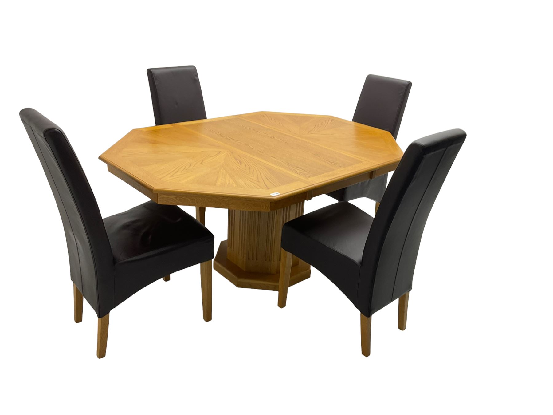 Oak octagonal extending dining table with additional leaf, octagonal pedestal base with fluting (150cm x 105cm x 76cm), and set four high back dining chairs upholstered in chocolate brown faux leather on square tapering supports (47cm x 54cm x 102cm)